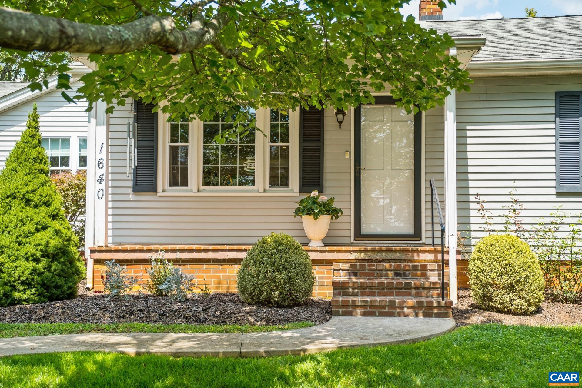 1640 Pea Ridge Road Stanardsville, VA 22973 - Photo 7 of 51 a front view of a house with garden