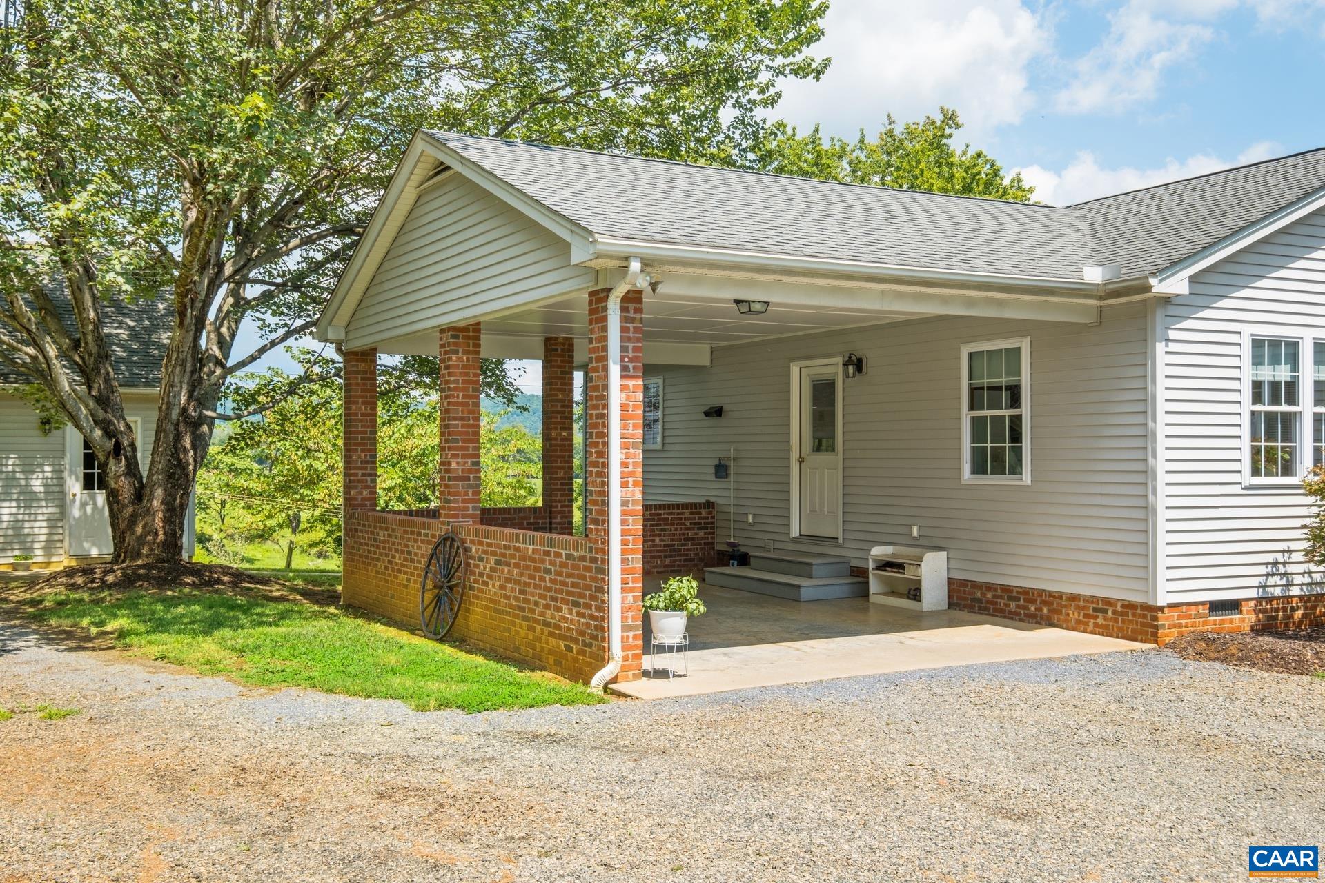 1640 Pea Ridge Road Stanardsville, VA 22973 - Photo 9 of 51 a view of a house with a yard