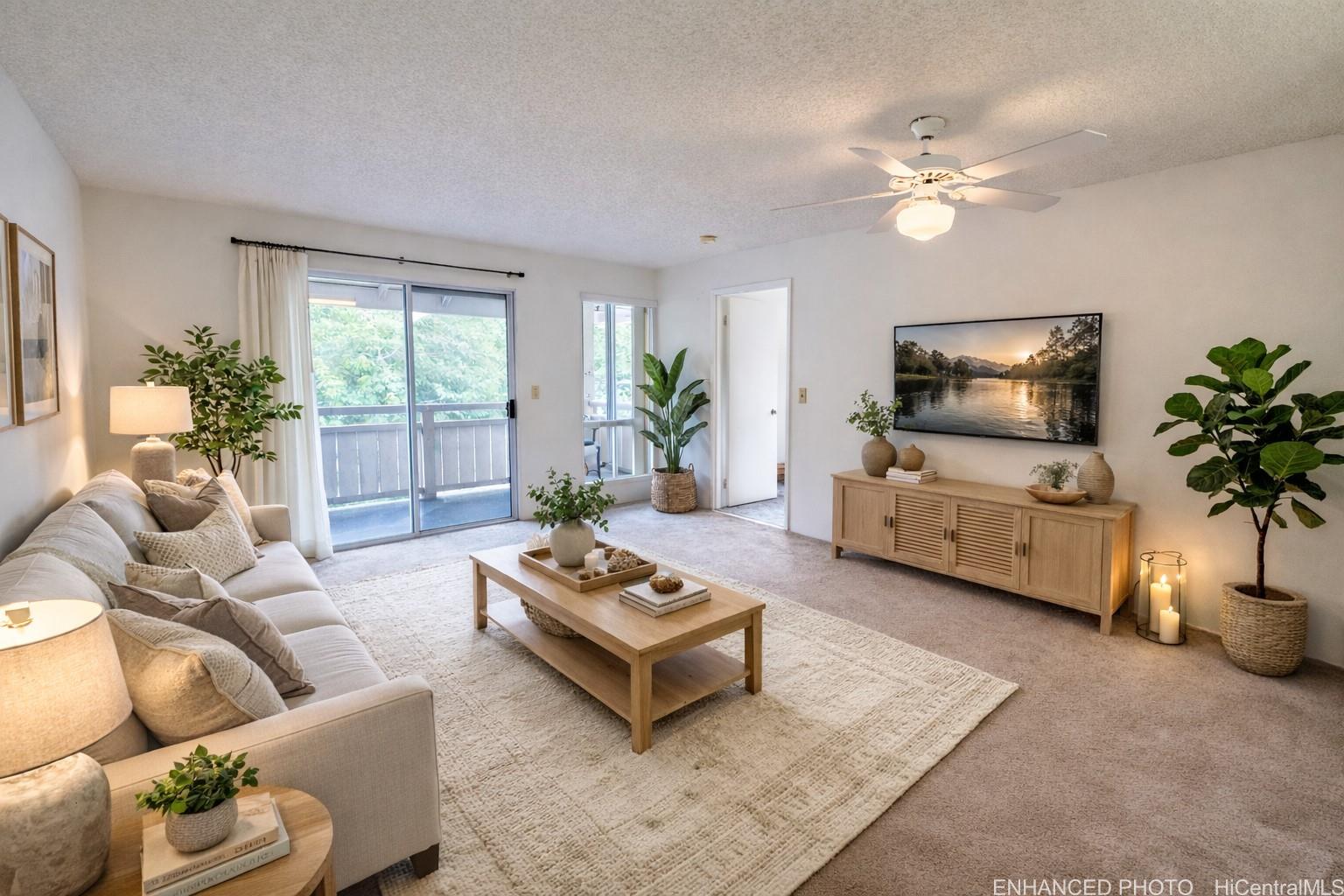 a living room with furniture a chandelier and a flat screen tv