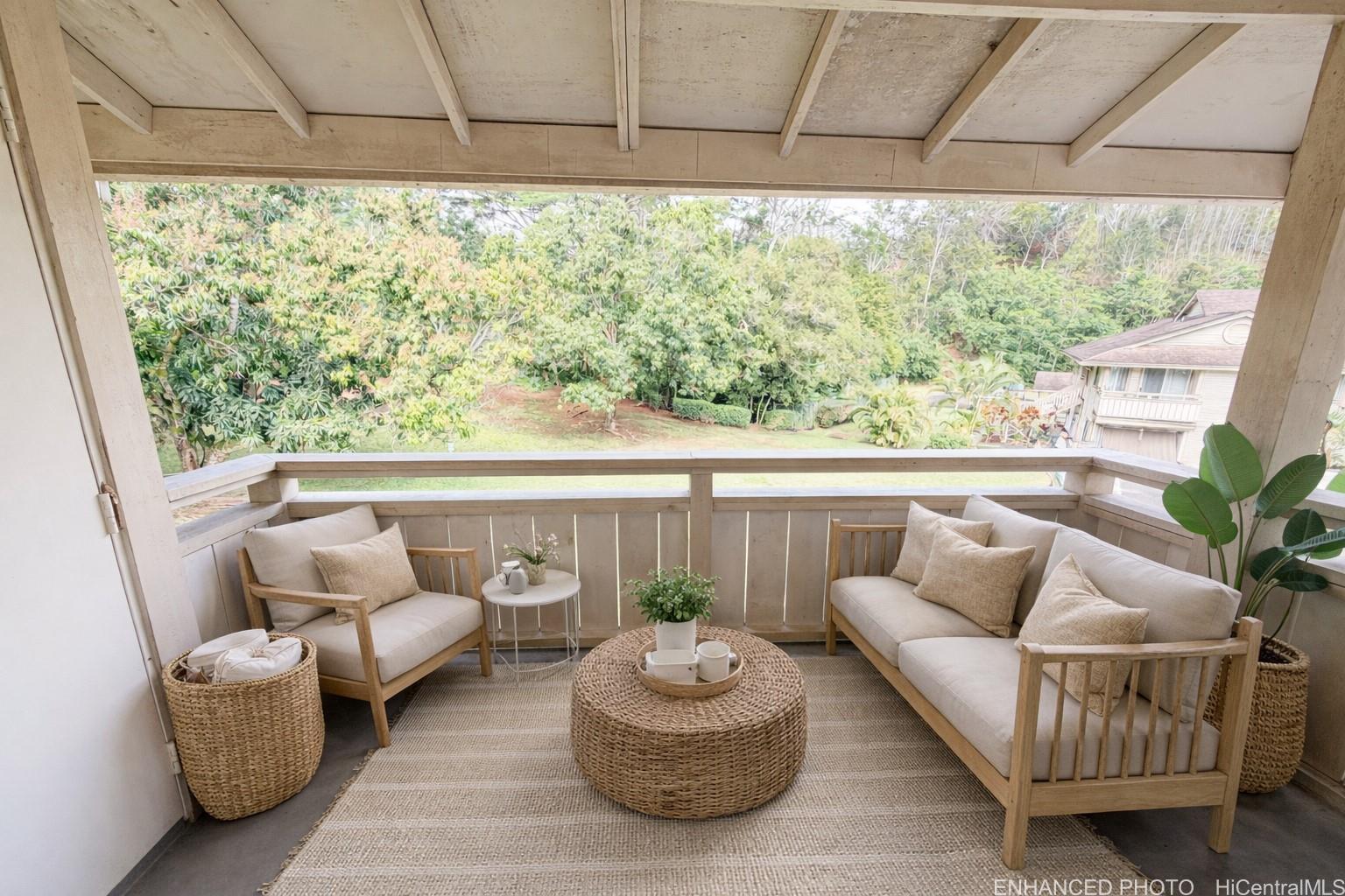95-510 Wikao Street, Unit Q206 Mililani, HI 96789 - Photo 11 of 19 a living room with furniture and a large window