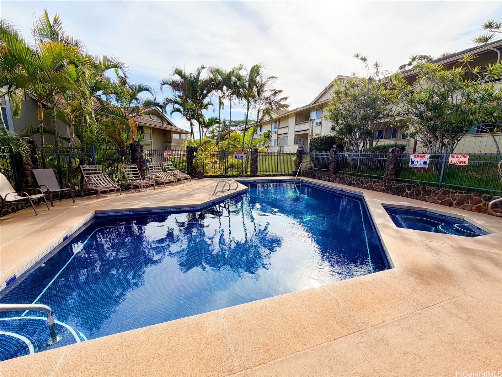 95-510 Wikao Street, Unit Q206 Mililani, HI 96789 - Photo 14 of 19 a view of a swimming pool with a patio