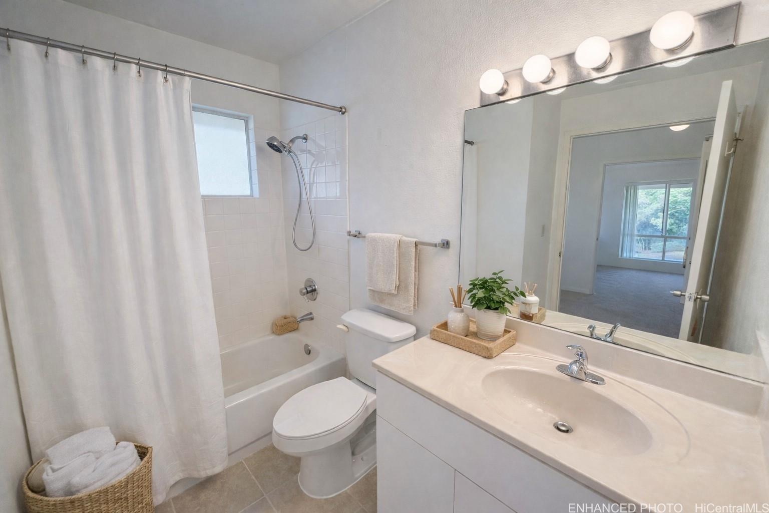 95-510 Wikao Street, Unit Q206 Mililani, HI 96789 - Photo 7 of 19 a bathroom with a sink toilet and shower