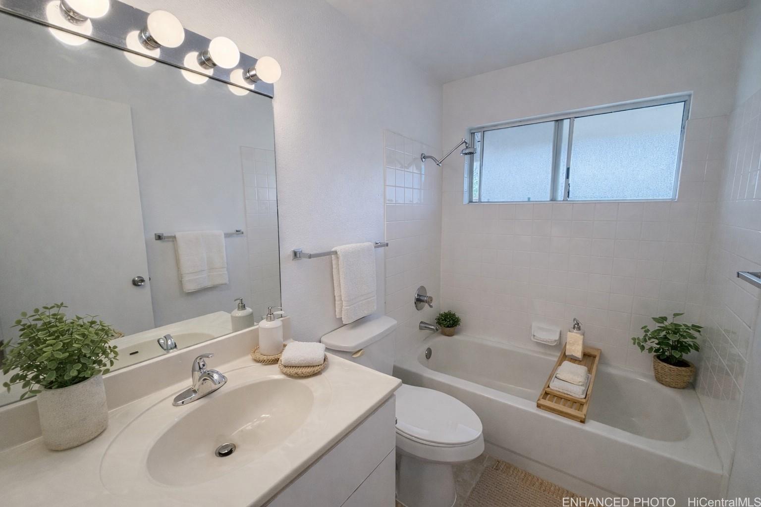 95-510 Wikao Street, Unit Q206 Mililani, HI 96789 - Photo 10 of 19 a bathroom with a sink toilet and shower