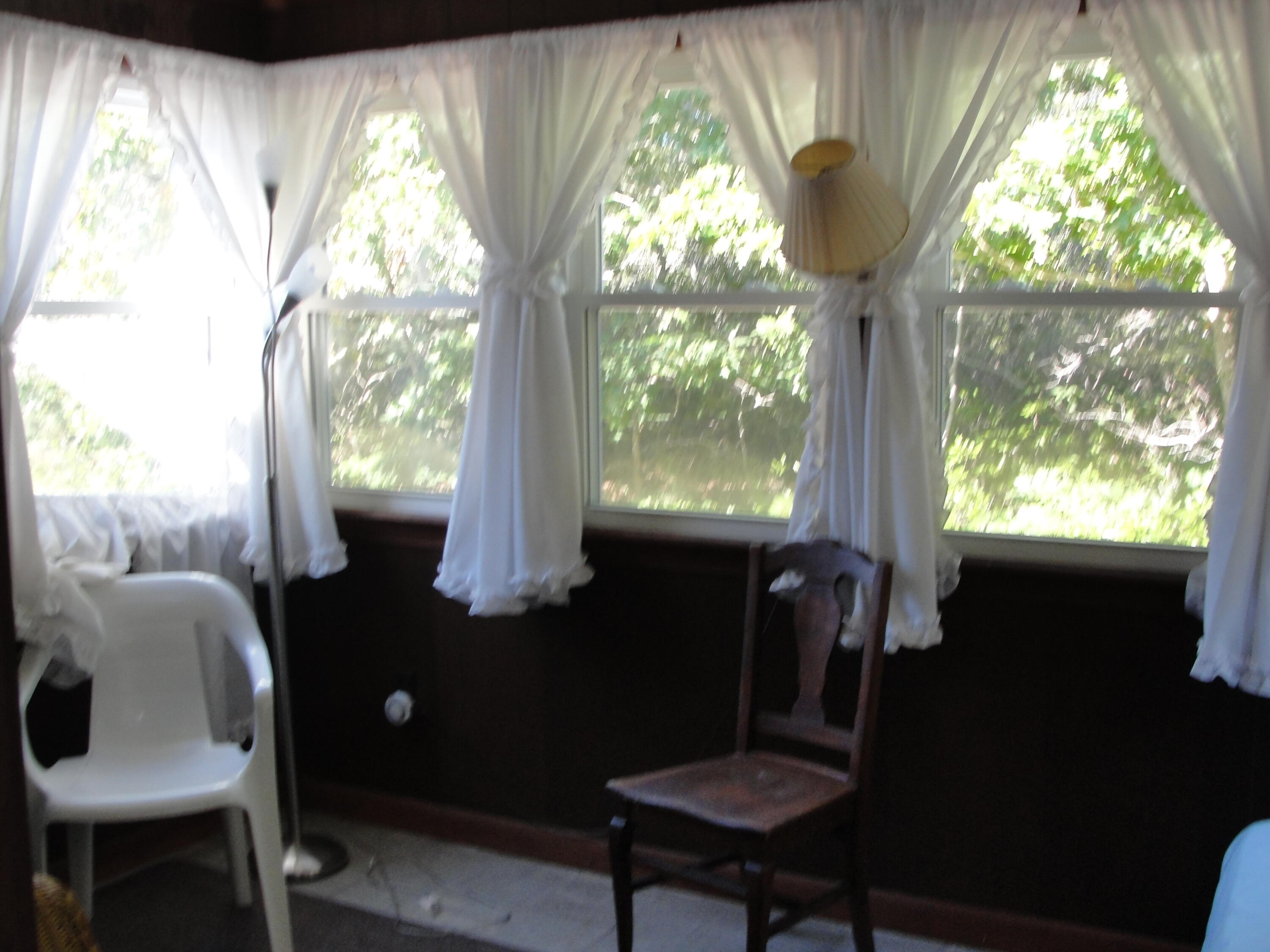 7 E Toms Path Dennis Port, MA 02639 - Photo 11 of 26 a living room with furniture and a window
