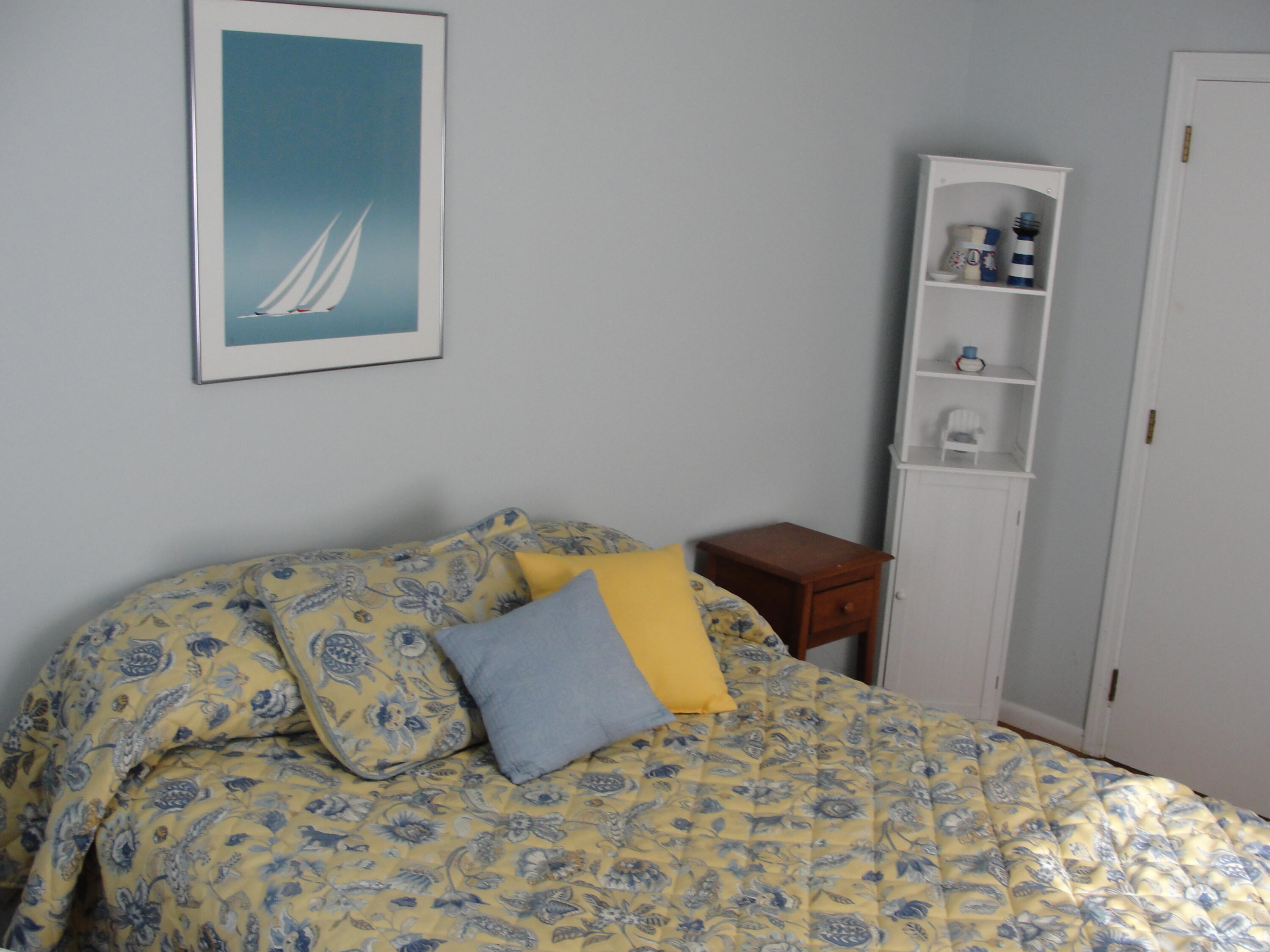 7 E Toms Path Dennis Port, MA 02639 - Photo 12 of 26 a bedroom with a bed and a window