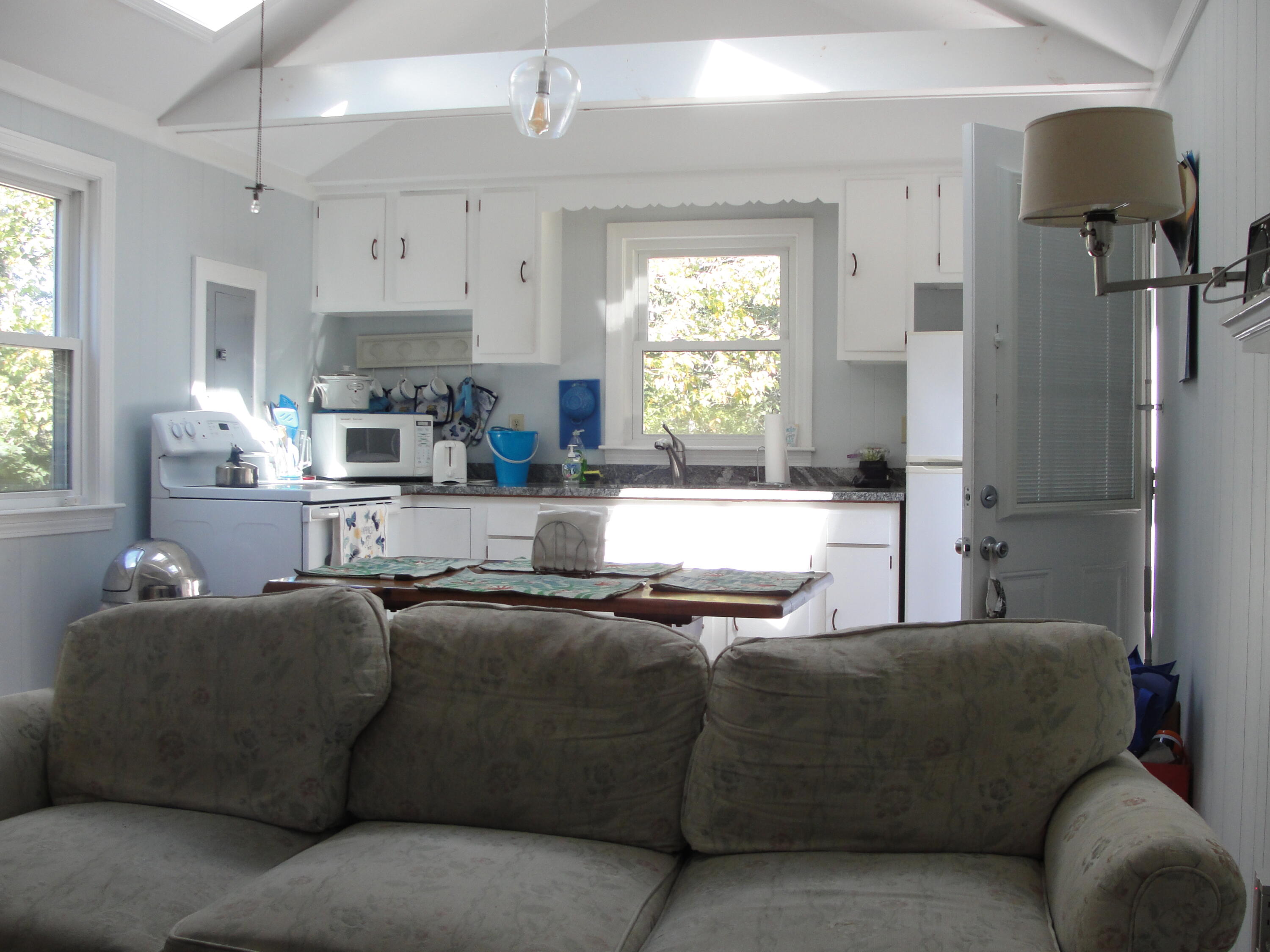 7 E Toms Path Dennis Port, MA 02639 - Photo 3 of 26 a living room with furniture and a large window