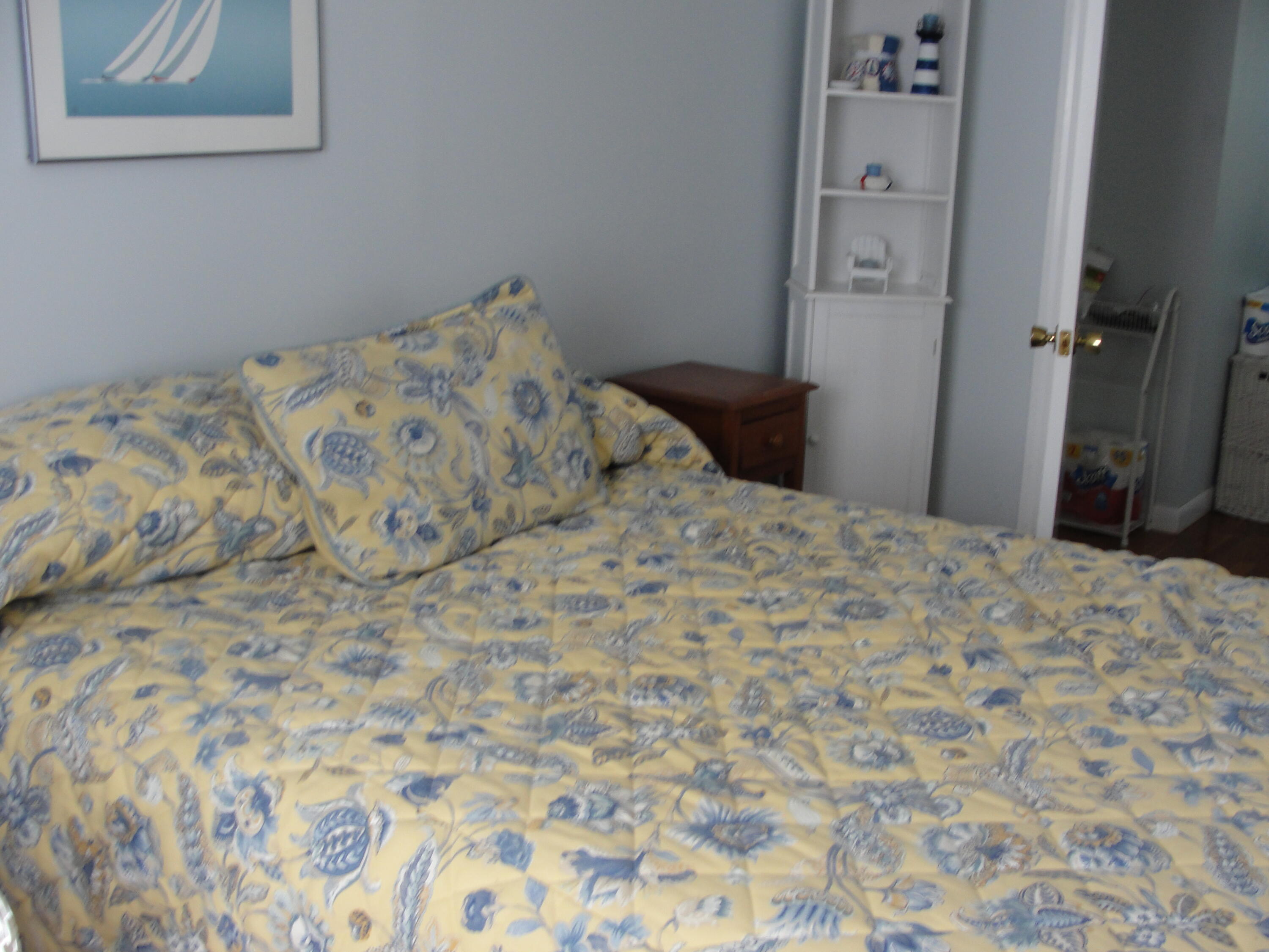 7 E Toms Path Dennis Port, MA 02639 - Photo 10 of 26 a bedroom with a bed and a cabinets