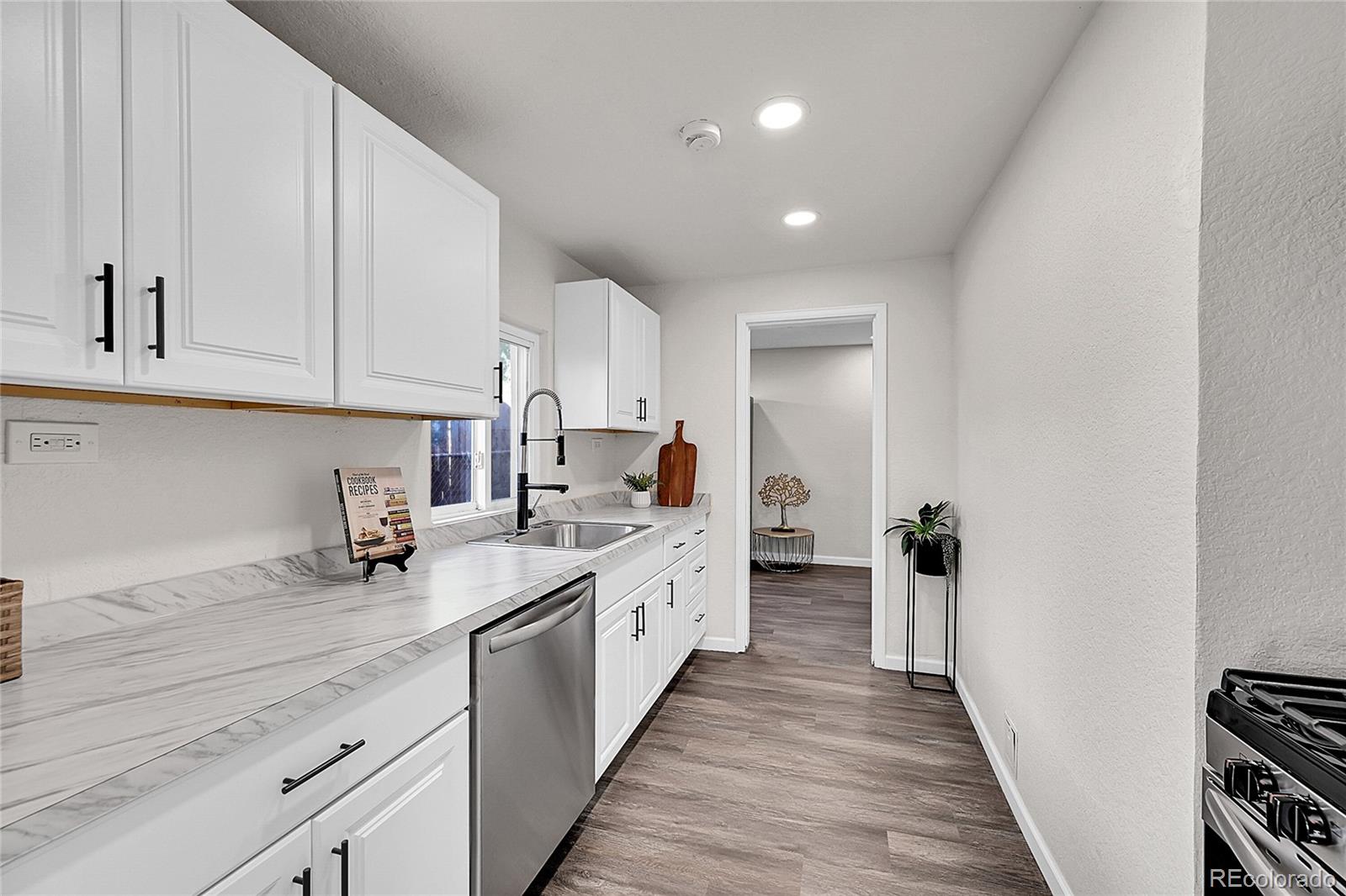 3984 Cook Street Denver, CO 80205 - Photo 11 of 29 a kitchen with sink and cabinets