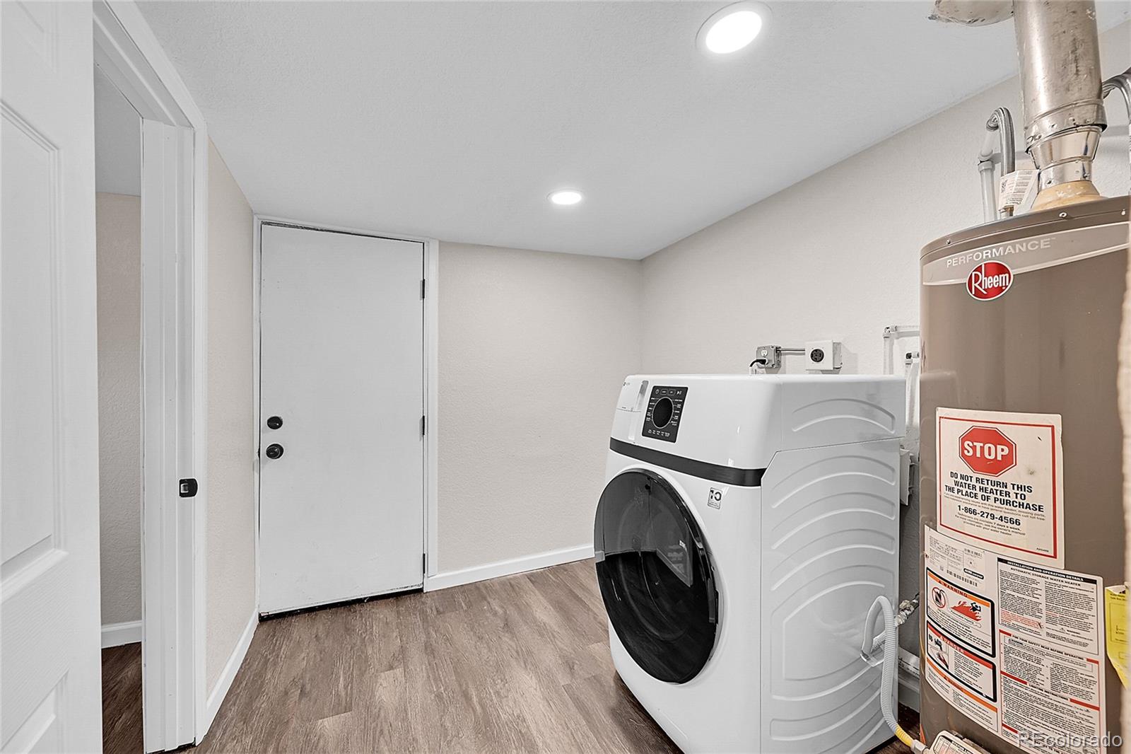 3984 Cook Street Denver, CO 80205 - Photo 18 of 29 a utility room with dryer and washer