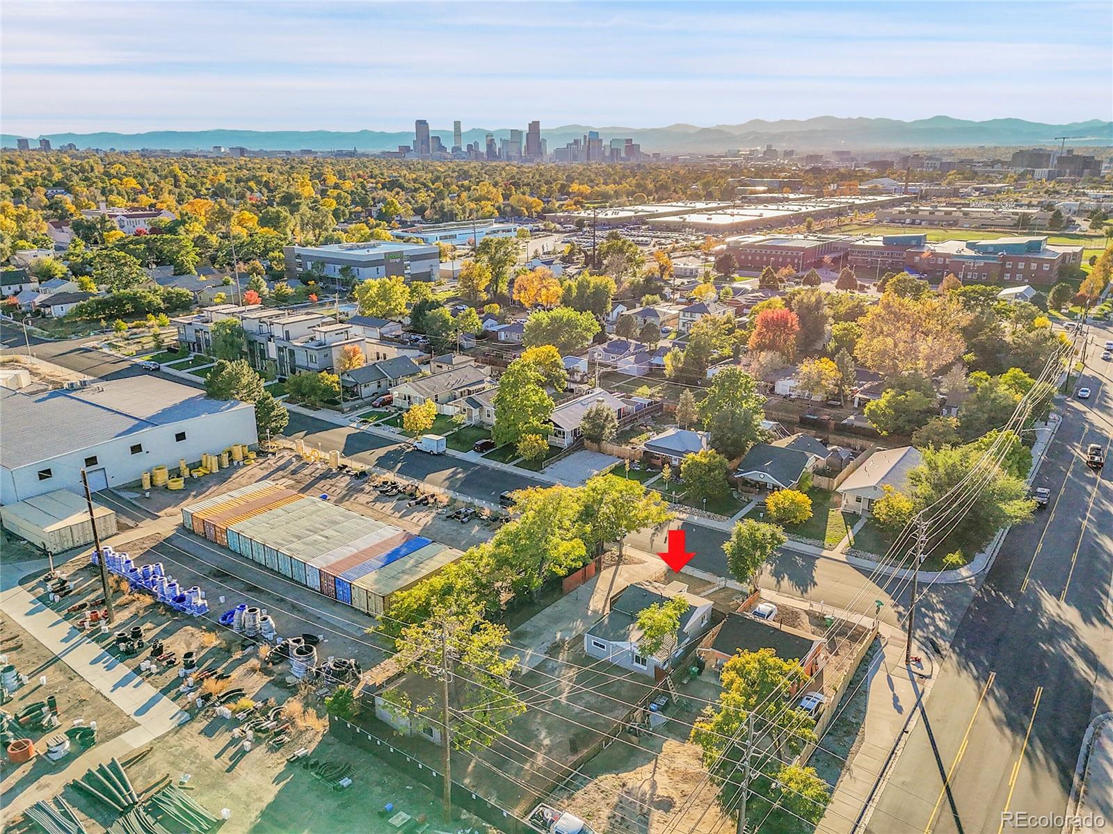 3984 Cook Street Denver, CO 80205 - Photo 23 of 29 an aerial view of residential building with parking and city view