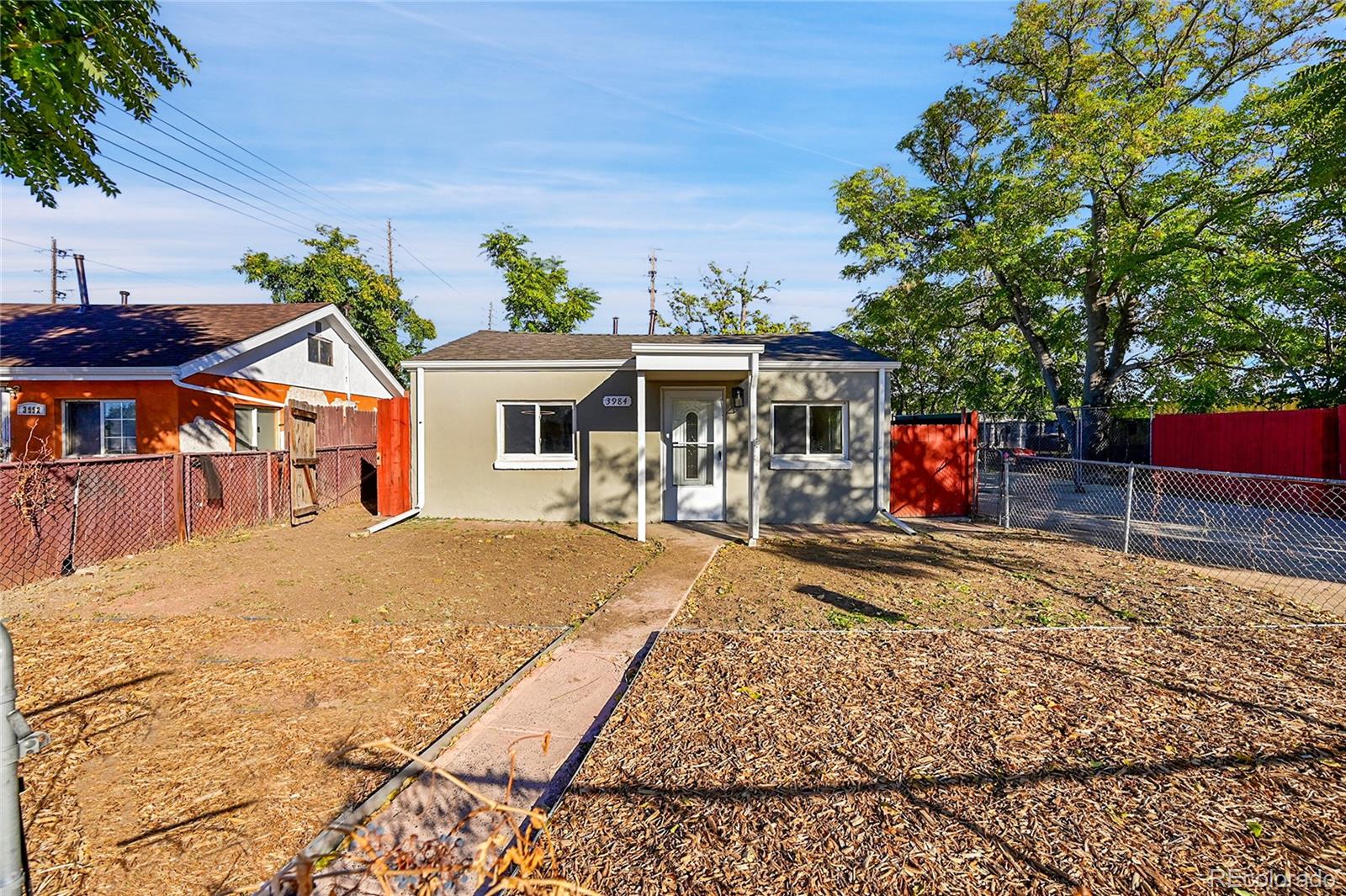 3984 Cook Street Denver, CO 80205 - Photo 3 of 29 a view of a house with basketball court