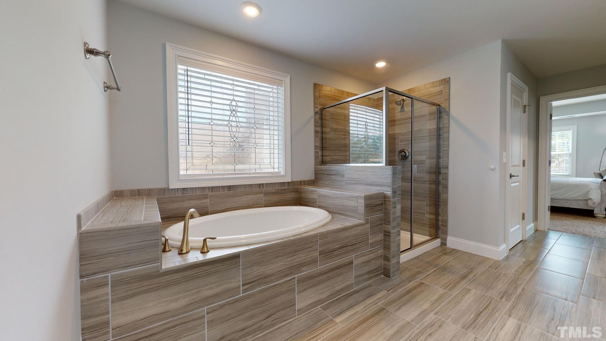 2351 Terrmini Drive Apex, NC 27502 - Photo 18 of 30 a spacious bathroom with a sink and a mirror