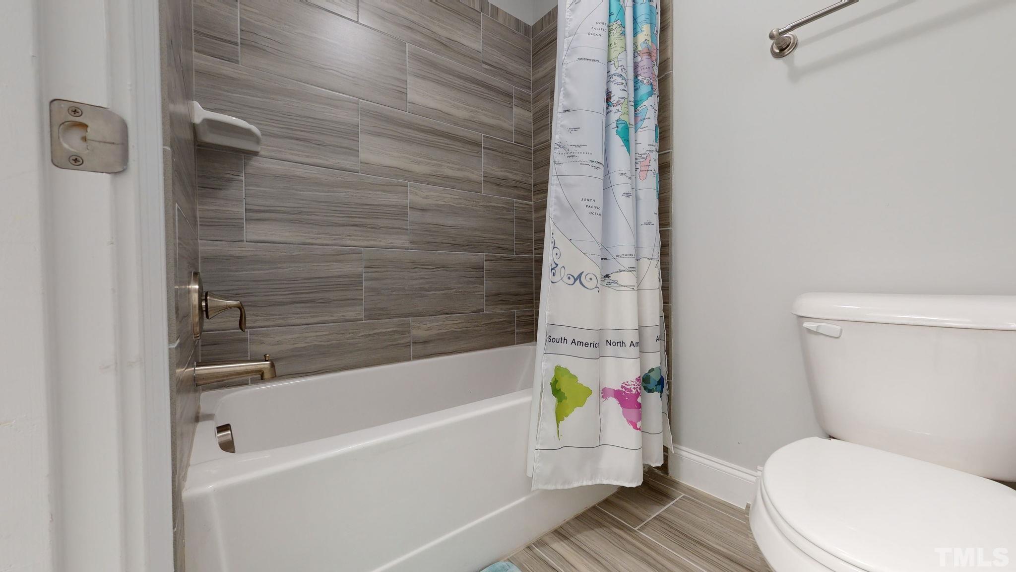 2351 Terrmini Drive Apex, NC 27502 - Photo 24 of 30 a bathroom with a sink and toilet