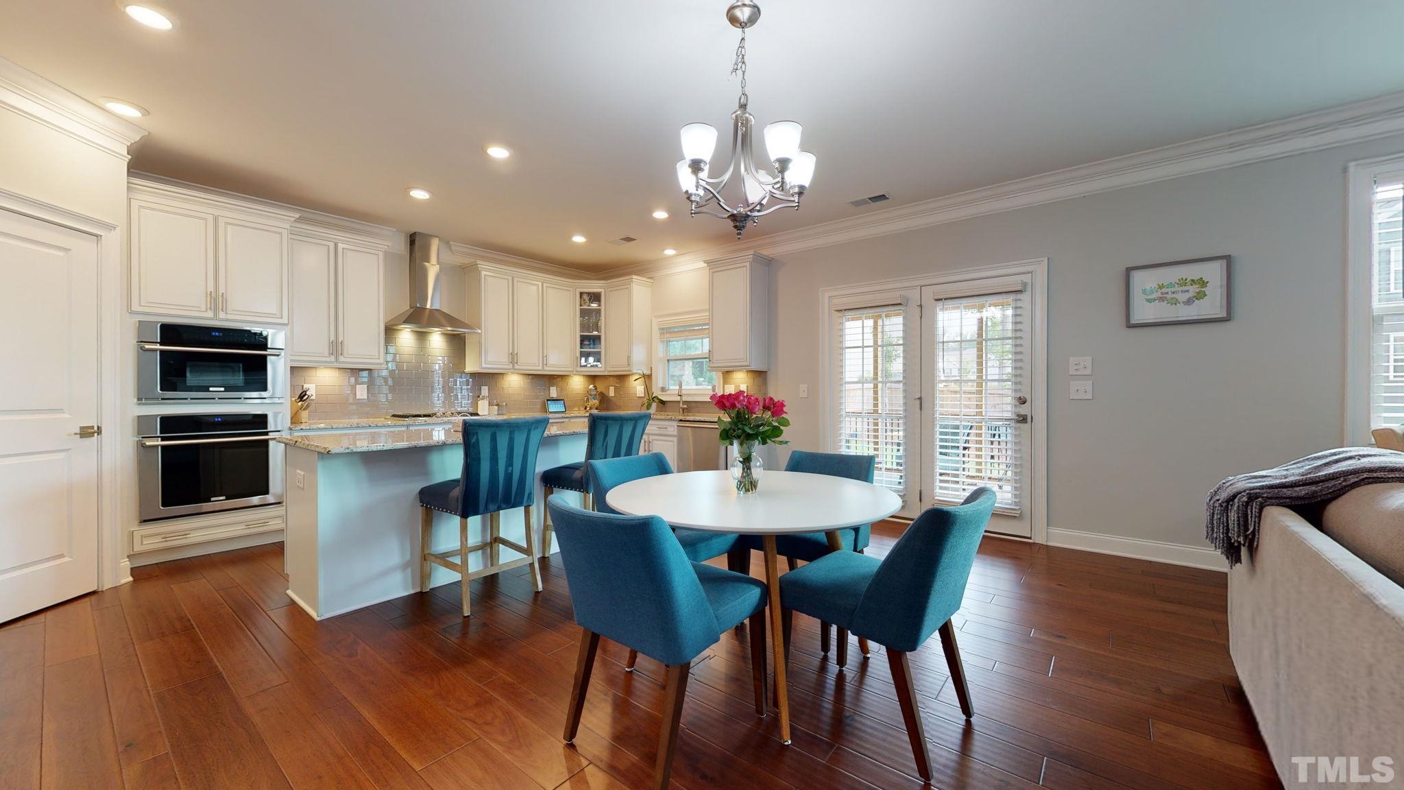 2351 Terrmini Drive Apex, NC 27502 - Photo 10 of 30 a view of a dining room with furniture window and wooden floor