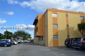 525 West 69th Street, Unit 211 Hialeah, FL 33014 - Photo 2 of 2 a view of a cars park in front of a building