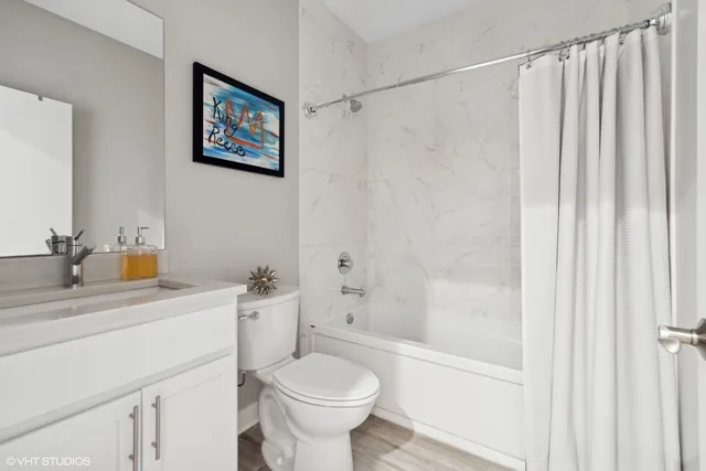 a bedroom with a large bed and a couch