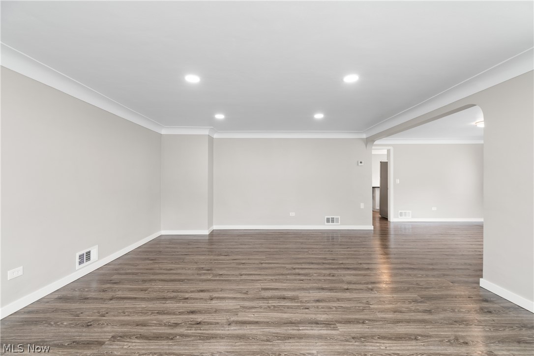 10876 West Sprague Road Cleveland, OH 44130 - Photo 11 of 31 Empty room with crown molding and dark hardwood / wood-style floors