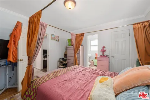 a bed room with a bed and a couch