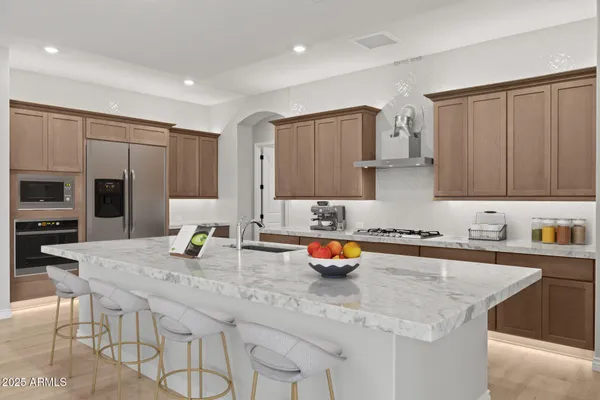 a living room with furniture and view of kitchen