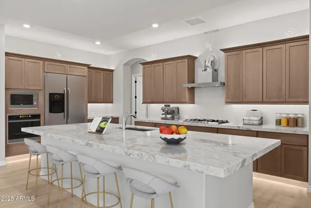 a living room with furniture and view of kitchen