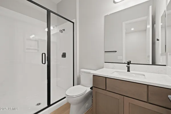 a view of a house with a yard and large tree