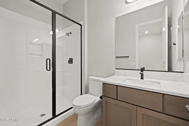 a view of a house with a yard and large tree