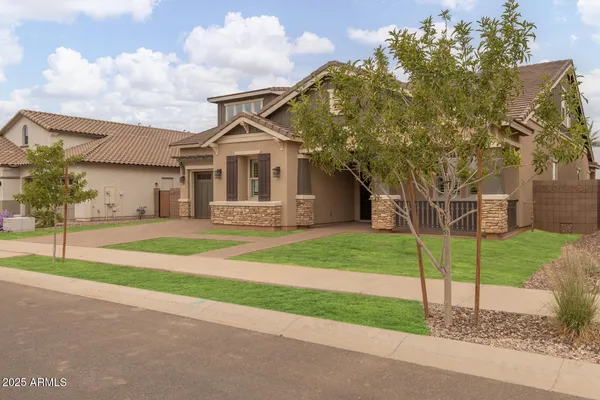 a living room with stainless steel appliances kitchen island granite countertop furniture a dining table and chairs