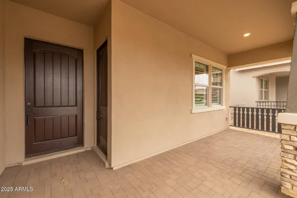 a large kitchen with stainless steel appliances granite countertop a large counter top and a wooden floors
