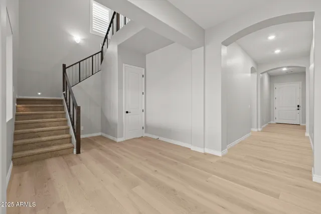 a kitchen with a sink a stove and chairs