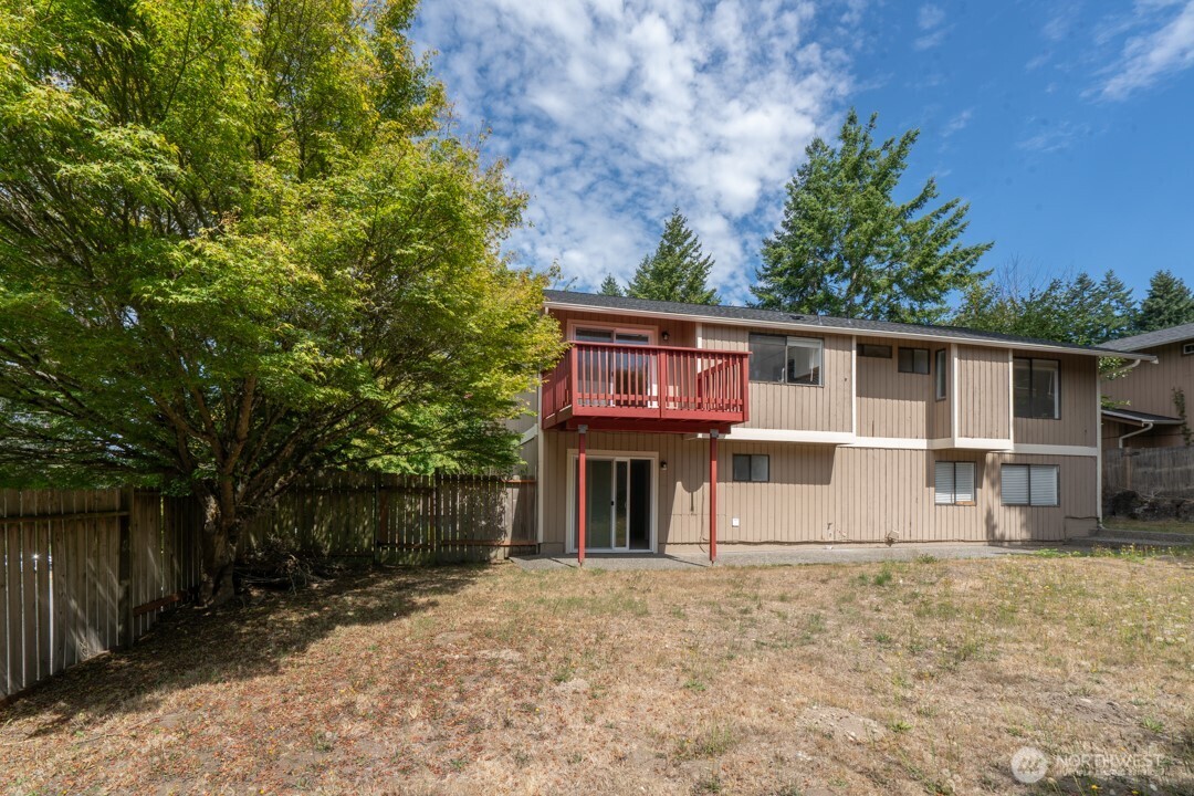 529 Southwest 324th Street Federal Way, WA 98023 - Photo 21 of 22 a view of a house with a yard and tree s