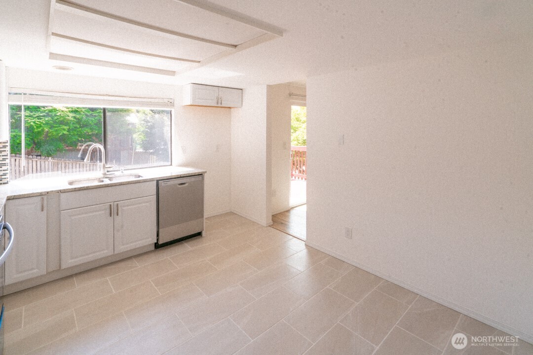 529 Southwest 324th Street Federal Way, WA 98023 - Photo 5 of 22 a view of a kitchen with a sink and a large window