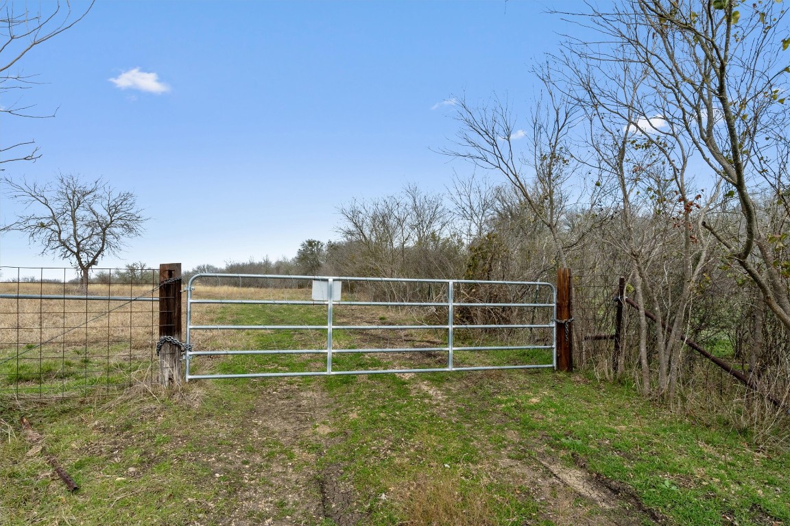 0 Rolling Ridge Road Lockhart, TX 78644 - Photo 5 of 34 a view of a room with a yard and wooden fence