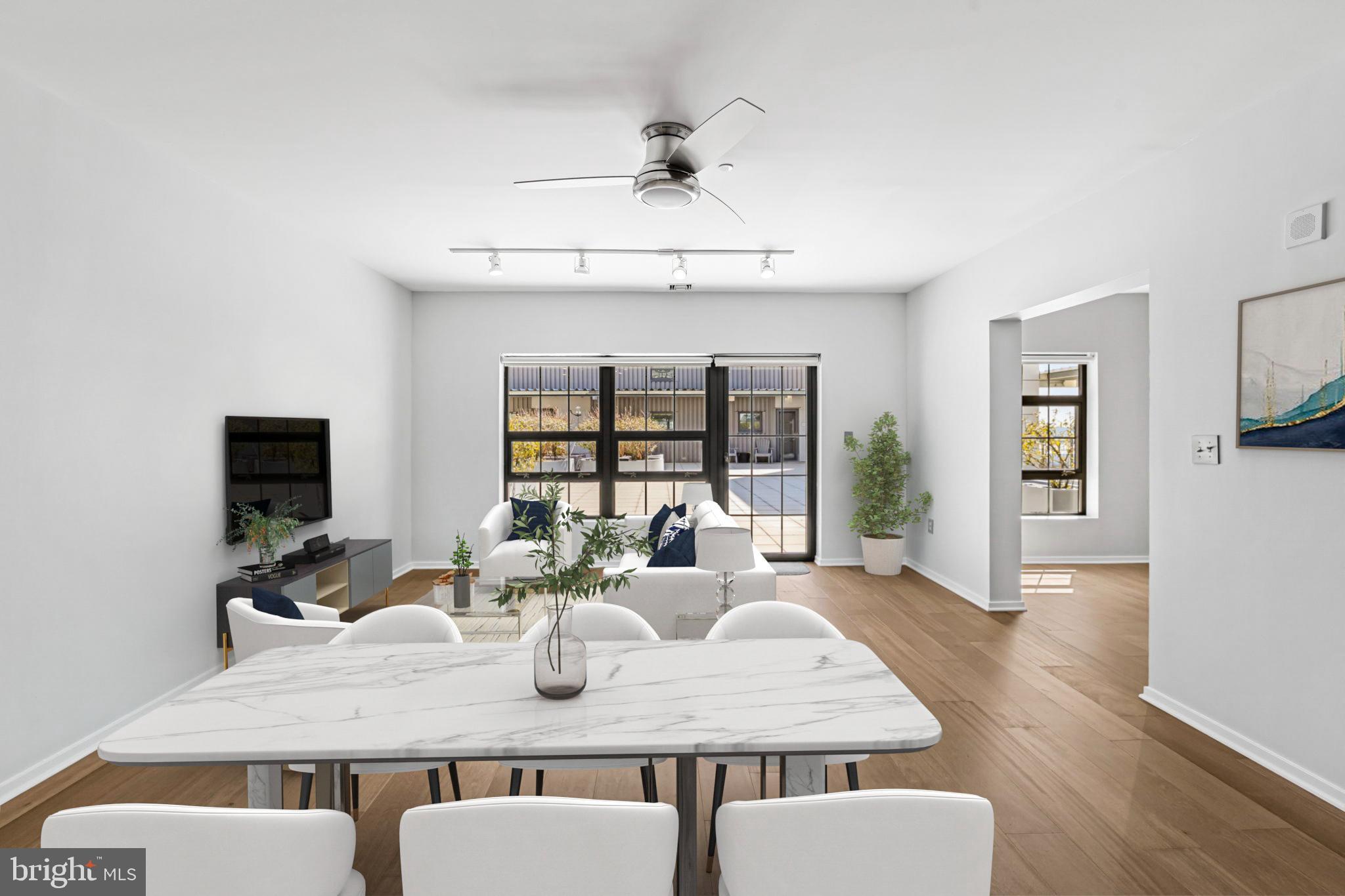 1200 Steuart Street, Unit 1035 Baltimore, MD 21230 - Photo 11 of 96 a view of a dining room with furniture wooden floor and chandelier