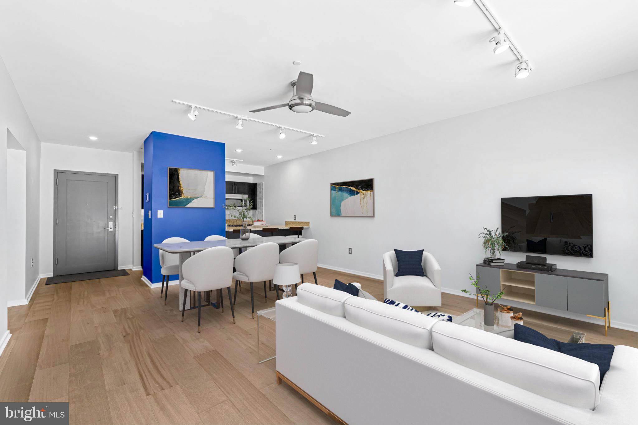 1200 Steuart Street, Unit 1035 Baltimore, MD 21230 - Photo 19 of 96 a living room with furniture and a flat screen tv