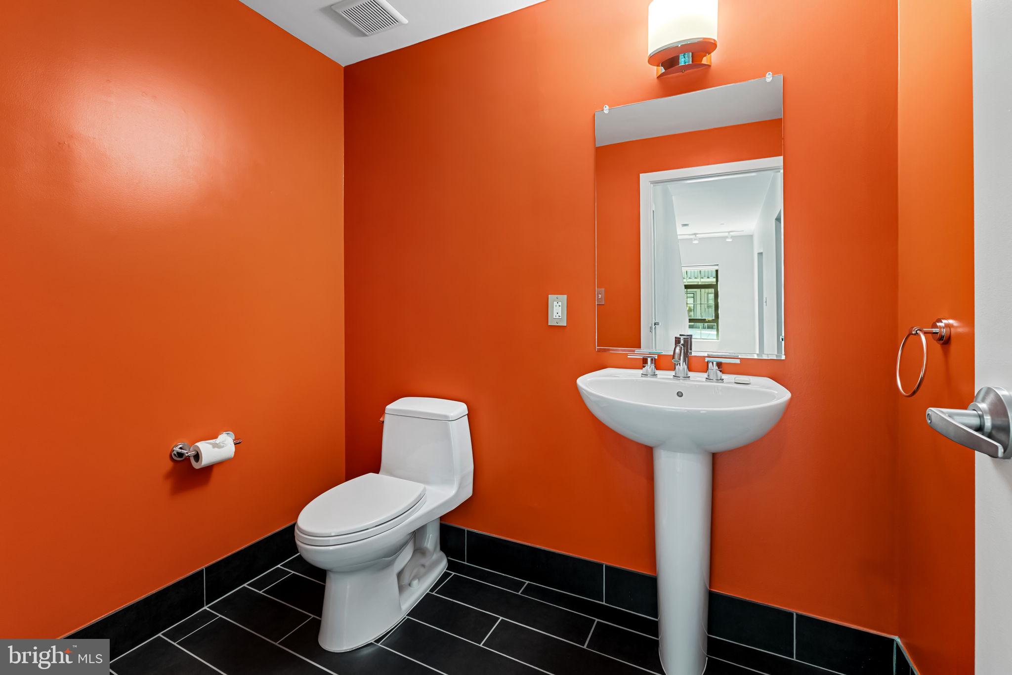 1200 Steuart Street, Unit 1035 Baltimore, MD 21230 - Photo 27 of 96 a bathroom with a sink and a mirror