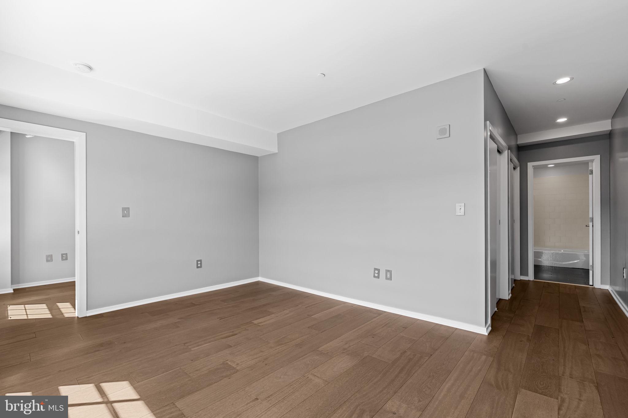 1200 Steuart Street, Unit 1035 Baltimore, MD 21230 - Photo 36 of 96 wooden floor in an empty room