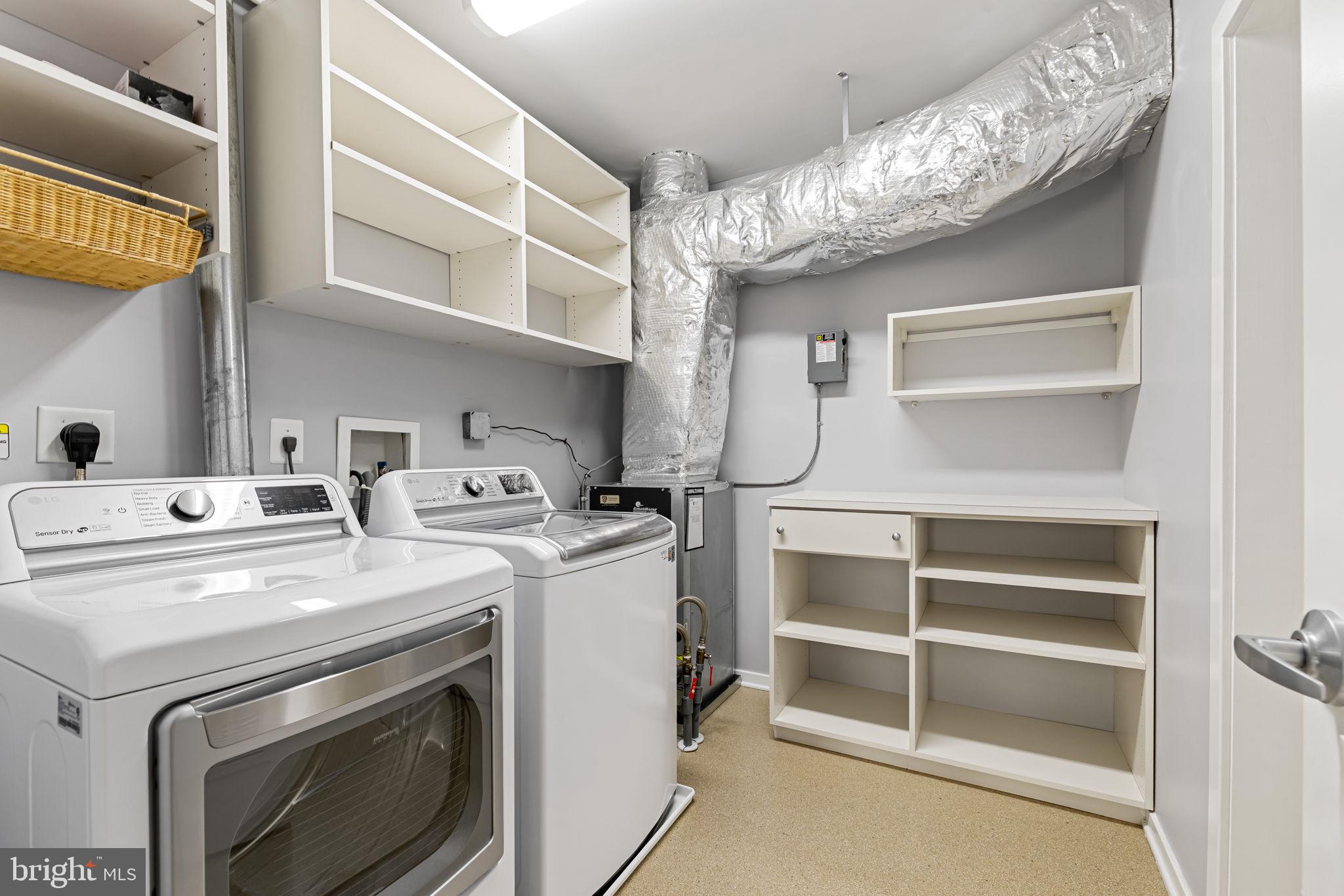 1200 Steuart Street, Unit 1035 Baltimore, MD 21230 - Photo 40 of 96 a utility room with dryer and washer