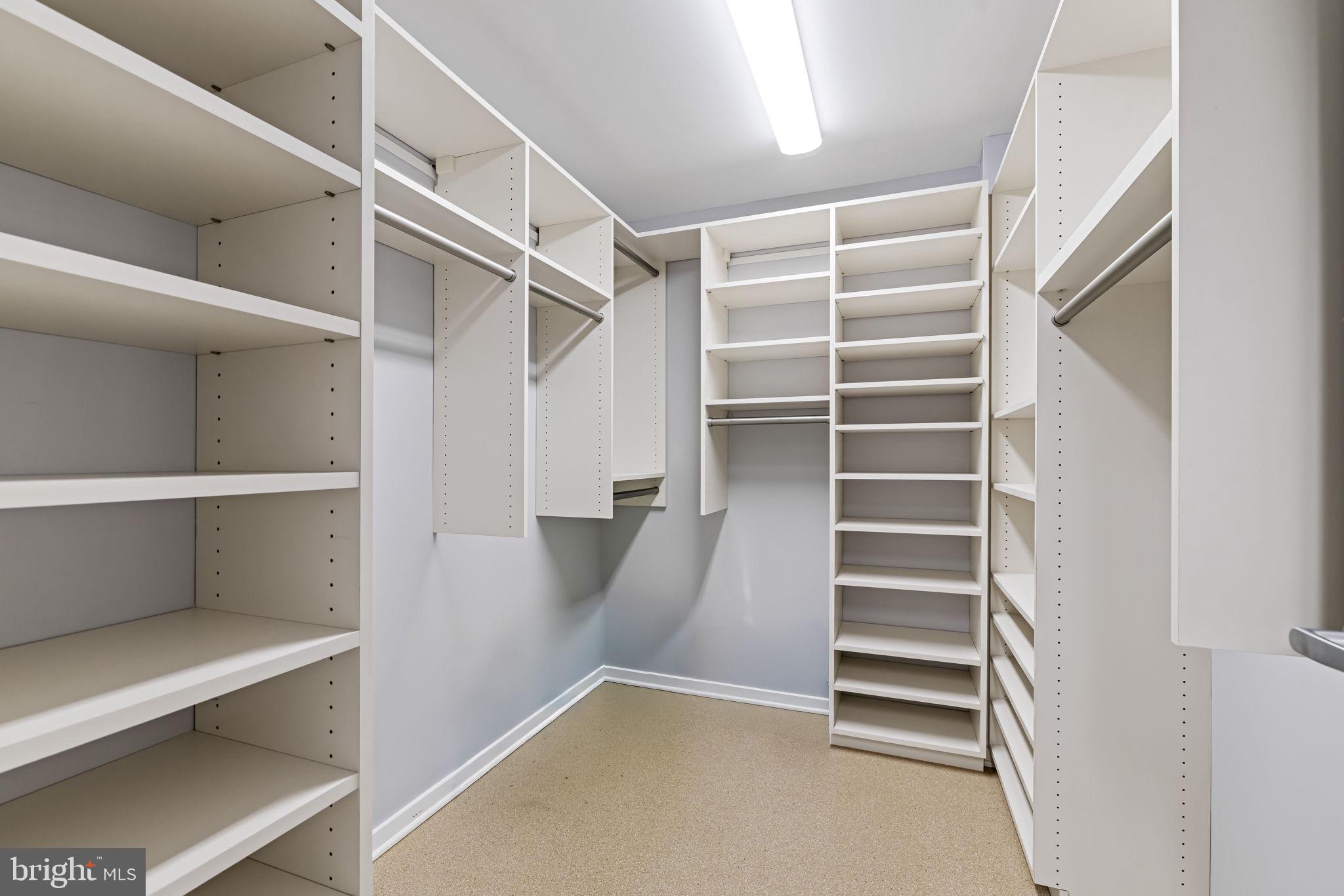 1200 Steuart Street, Unit 1035 Baltimore, MD 21230 - Photo 41 of 96 a view of walk in closet with empty racks