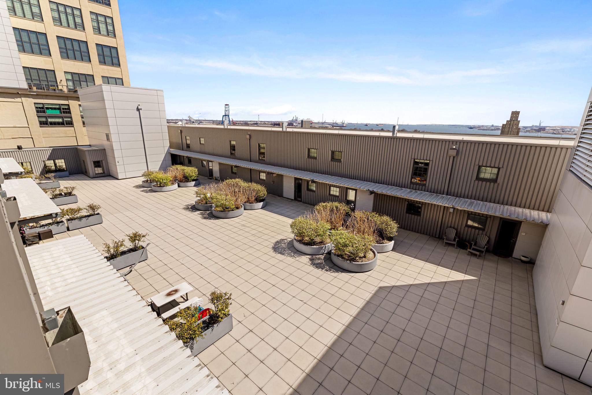 1200 Steuart Street, Unit 1035 Baltimore, MD 21230 - Photo 45 of 96 a view of terrace with seating area and barbeque oven