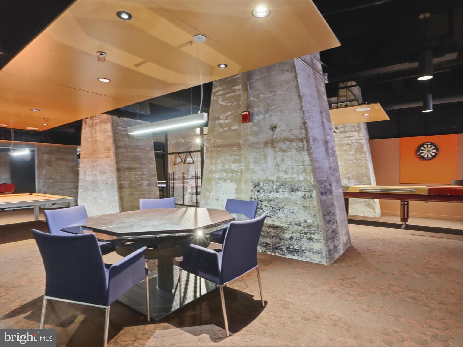 1200 Steuart Street, Unit 1035 Baltimore, MD 21230 - Photo 80 of 96 a dining room with furniture and a potted plant