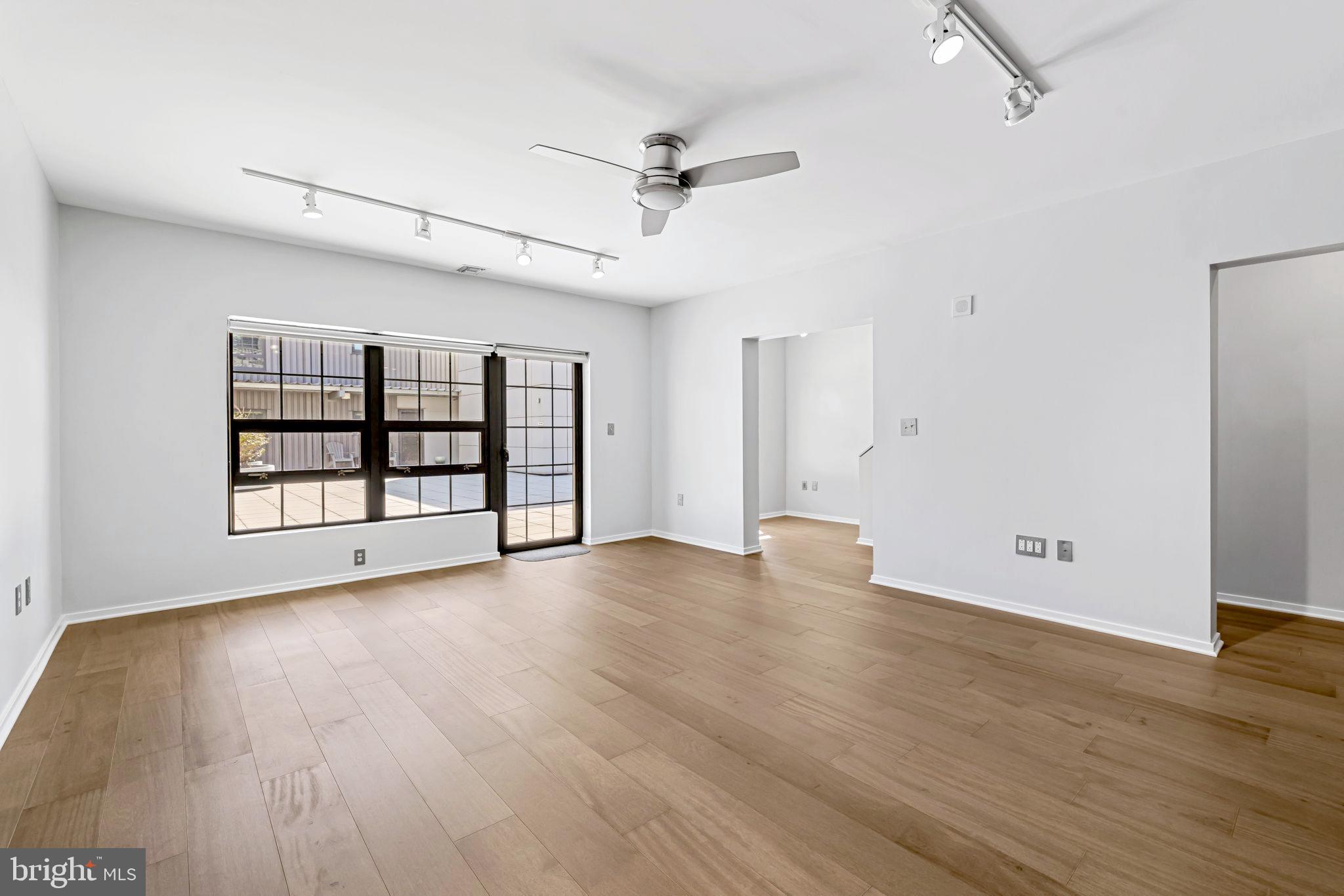 1200 Steuart Street, Unit 1035 Baltimore, MD 21230 - Photo 8 of 96 wooden floor in an empty room with a window