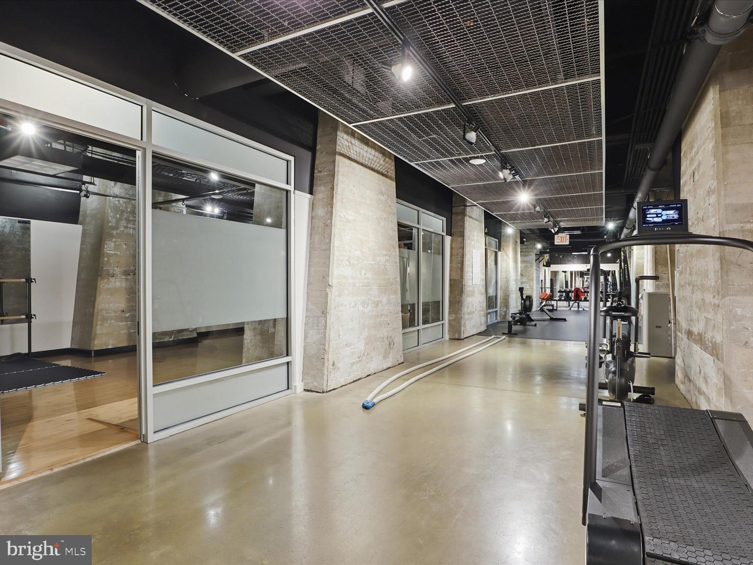 1200 Steuart Street, Unit 1035 Baltimore, MD 21230 - Photo 83 of 96 a view of a gallery with wooden floor