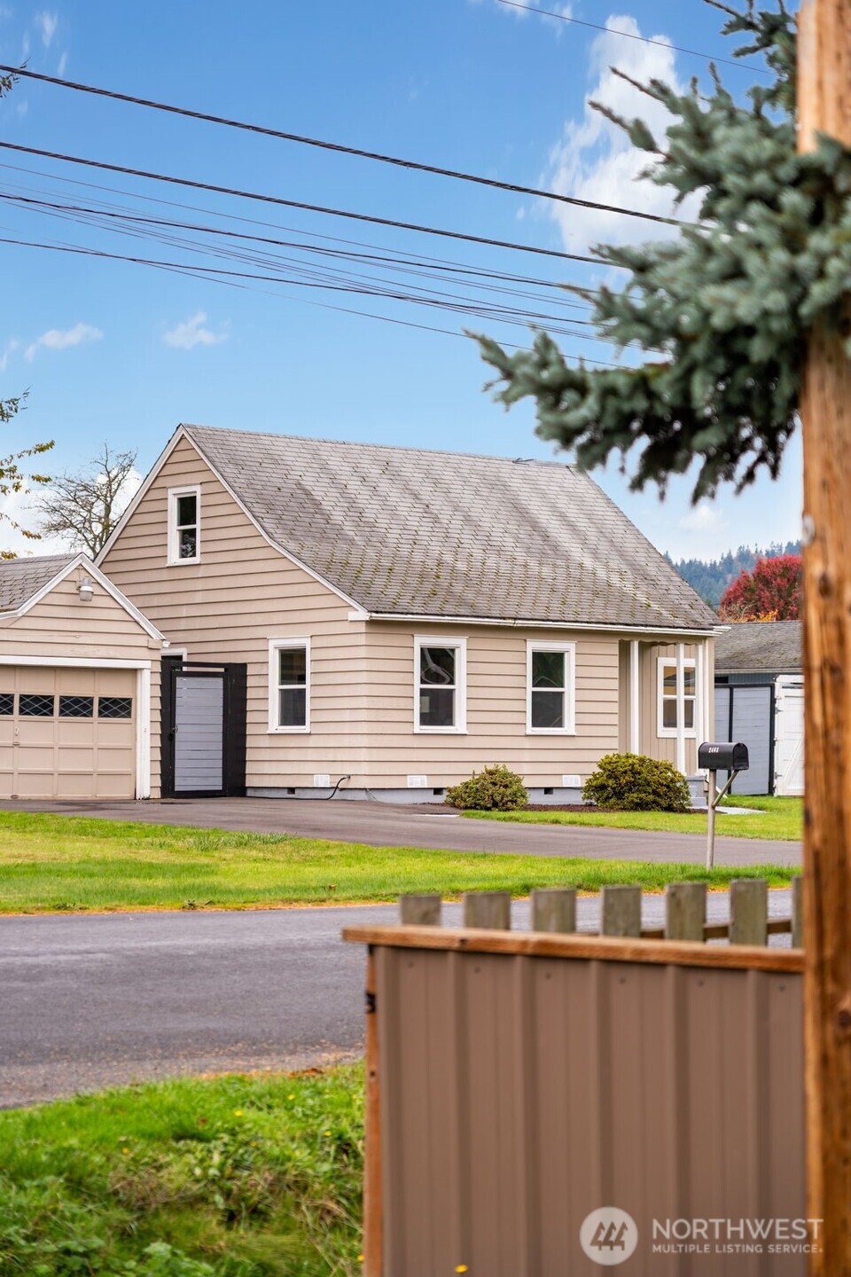 2403 34th Avenue Longview, WA 98632 - Photo 1 of 40 a front view of a house with a yard and garage