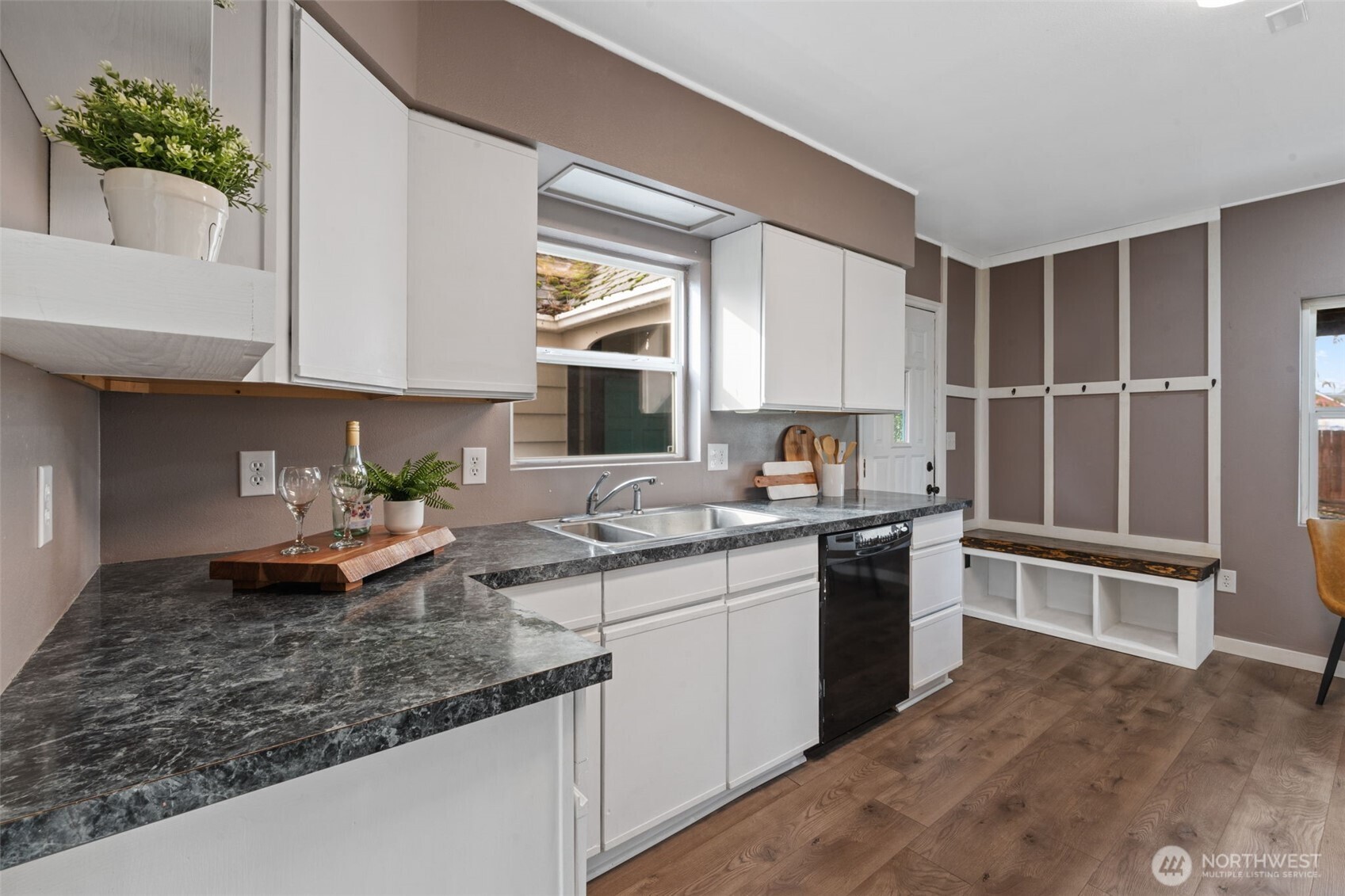 2403 34th Avenue Longview, WA 98632 - Photo 11 of 40 a kitchen with stainless steel appliances granite countertop a sink stove and cabinets