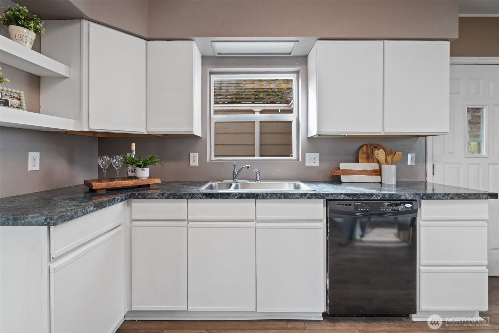 2403 34th Avenue Longview, WA 98632 - Photo 13 of 40 a kitchen with granite countertop white cabinets and white appliances