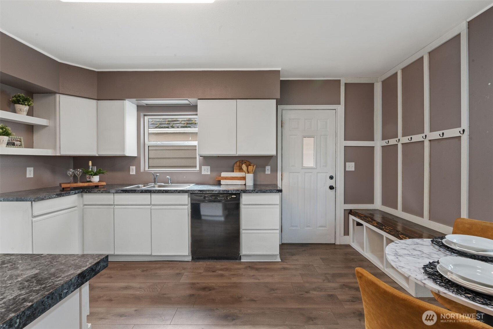 2403 34th Avenue Longview, WA 98632 - Photo 14 of 40 a kitchen with granite countertop a sink stove and refrigerator