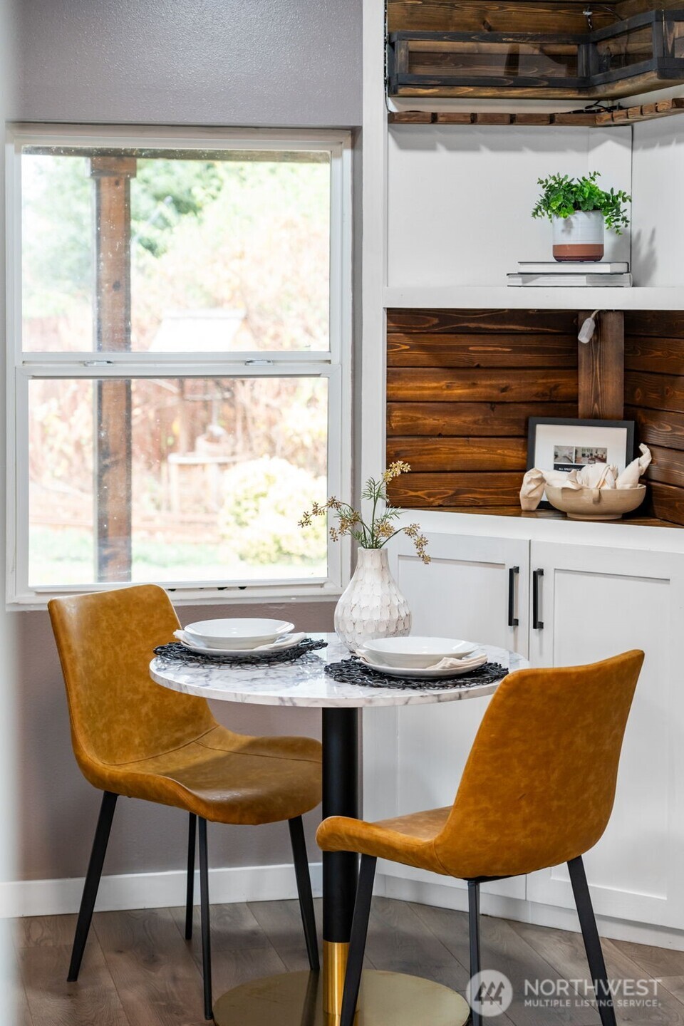 2403 34th Avenue Longview, WA 98632 - Photo 16 of 40 a kitchen with a table chairs and wooden floor