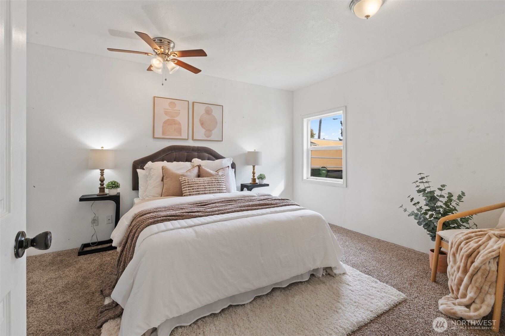 2403 34th Avenue Longview, WA 98632 - Photo 17 of 40 a bedroom with a bed and a chandelier