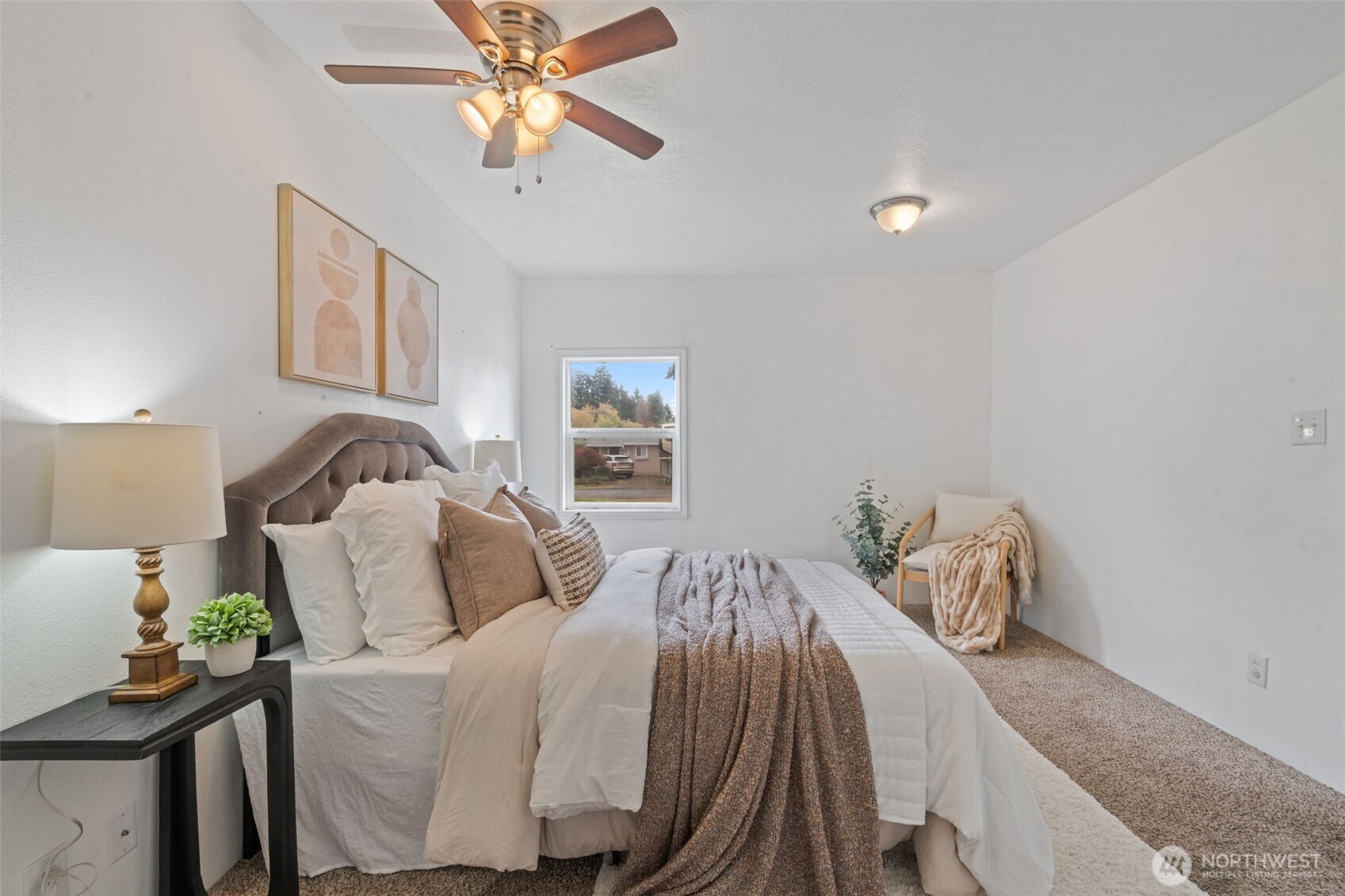 2403 34th Avenue Longview, WA 98632 - Photo 19 of 40 a bedroom with a bed and wooden floor