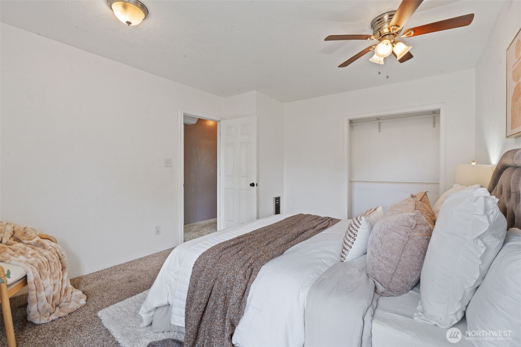 2403 34th Avenue Longview, WA 98632 - Photo 21 of 40 a bedroom with a bed and a chandelier